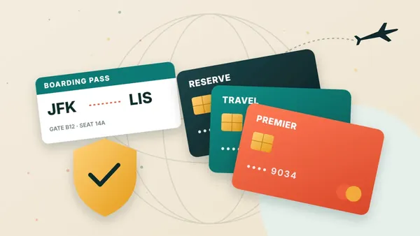 Credit cards, passport and boarding pass on a world map